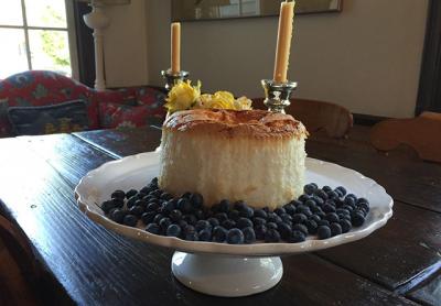 An angel food cake can be flavored with lemon, coffee, or other essences and served with blueberries, as in this version of the dessert classic. An angel food cake can be flavored with lemon, coffee, or other essences and served with blueberries, as in this version of the dessert classic.