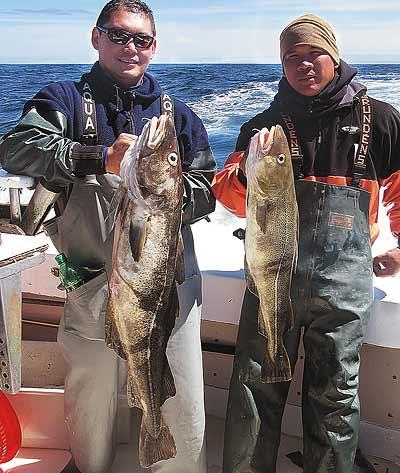 Dennis Rodriguez, left, and Rod Augustin showed off two of a number of large cod they caught while fishing from the Blue Fin IV charter boat last week. Augustin, a marine, will begin his fifth tour in Afghanistan next week. Dennis Rodriguez, left, and Rod Augustin showed off two of a number of large cod they caught while fishing from the Blue Fin IV charter boat last week. Augustin, a marine, will begin his fifth tour in Afghanistan next week.