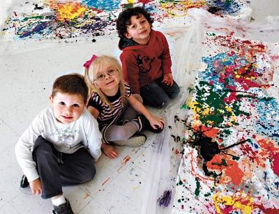 Ryan Darrell, Lila Gabbard, and Edmar Gonzalez posed with some Jackson Pollock-inspired masterpieces created in advance of what would have been Pollock’s 100th birthday on Saturday.