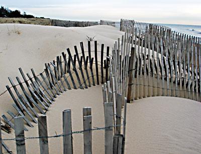 East Hampton Town and Village are cracking down on sand fences when they are placed to extend private property, in the guise of growing dunes, onto public beach.
