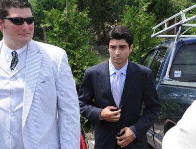 Lee Hnetinka, right, with Michael A. Gajdos, his new attorney, was arraigned in Southampton Town Justice Court on Friday on 59 charges, mostly misdemeanors, in connection with alleged party house rentals. Lee Hnetinka, right, with Michael A. Gajdos, his new attorney, was arraigned in Southampton Town Justice Court on Friday on 59 charges, mostly misdemeanors, in connection with alleged party house rentals.