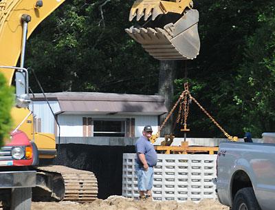 Residents of the Three Mile Harbor Trailer Park hope that a new septic system will bring relief from sewage spills and backups. Residents of the Three Mile Harbor Trailer Park hope that a new septic system will bring relief from sewage spills and backups.