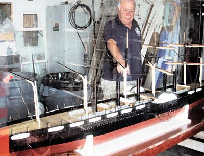 Brian Pope, assistant site manager of the Montauk Lighthouse Museum, pointed to one of two side wheels on a scale model of the S.S. Great Eastern purchased by the museum in August. The model is being readied for display. Brian Pope, assistant site manager of the Montauk Lighthouse Museum, pointed to one of two side wheels on a scale model of the S.S. Great Eastern purchased by the museum in August. The model is being readied for display.