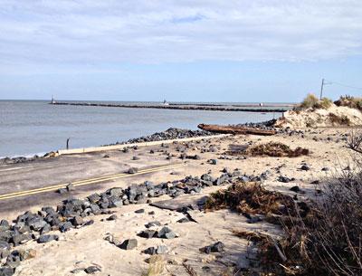 Rocks that once helped protect Soundview Drive in Montauk were thrown by the heavy surf onto the pavement. Rocks that once helped protect Soundview Drive in Montauk were thrown by the heavy surf onto the pavement.