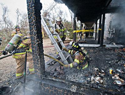 A volunteer firefighter emerged from a lower level at the Sea Crest motel on Napeague following a fire there on Nov. 7 that destroyed several units. A volunteer firefighter emerged from a lower level at the Sea Crest motel on Napeague following a fire there on Nov. 7 that destroyed several units.