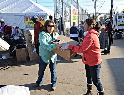 Dorine Drohan, left, and Marilyn Torres of East End Cares unloaded donated goods at St. Francis de Sales Catholic Church in Belle Harbor in the Rockaways on Sunday. Dorine Drohan, left, and Marilyn Torres of East End Cares unloaded donated goods at St. Francis de Sales Catholic Church in Belle Harbor in the Rockaways on Sunday.