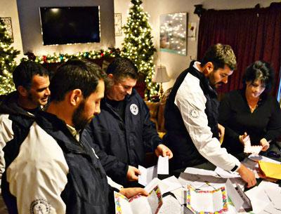Coach Rich Brierley, far left, and players Nicholas Lawler, Ryan Borowsky, and Nick Finazzo stopped by the home of Melissa Ann Mitchell, at right, to pick up letters of support for residents of the Rockaways. Coach Rich Brierley, far left, and players Nicholas Lawler, Ryan Borowsky, and Nick Finazzo stopped by the home of Melissa Ann Mitchell, at right, to pick up letters of support for residents of the Rockaways.