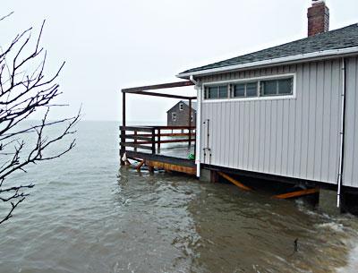 For the second time in two months, an extremely high tide in Gardiner’s Bay surrounded a house off Mulford Lane at Lazy Point, where the East Hampton Town Zoning Board of Appeals recently approved a revetment. For the second time in two months, an extremely high tide in Gardiner’s Bay surrounded a house off Mulford Lane at Lazy Point, where the East Hampton Town Zoning Board of Appeals recently approved a revetment.