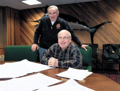 Montauk Fire Chief Rich Schoen, standing, looked at maps that Peter Joyce, a fireman and former chief, has identified as being among the most vulnerable to damage should a storm like Hurricane Sandy hit Montauk. Montauk Fire Chief Rich Schoen, standing, looked at maps that Peter Joyce, a fireman and former chief, has identified as being among the most vulnerable to damage should a storm like Hurricane Sandy hit Montauk.