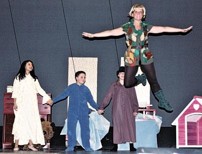 The Darling children, from left, Paula Guerra, Colin Freedman, and Dillon Andrada, watched Peter Pan, played by Jayne Freedman, take flight. The Darling children, from left, Paula Guerra, Colin Freedman, and Dillon Andrada, watched Peter Pan, played by Jayne Freedman, take flight.