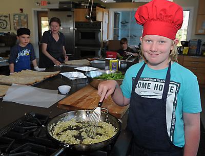 Stephen Cummings helped prepare lunch for his fellow students at the Hayground School in Bridgehampton on Tuesday. Stephen Cummings helped prepare lunch for his fellow students at the Hayground School in Bridgehampton on Tuesday.