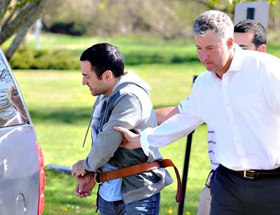Harry Dalian, left, at his arraignment Friday on charges that he impersonated a police officer during a visit to the John M. Marshall Elementary School in East Hampton on May 1. Harry Dalian, left, at his arraignment Friday on charges that he impersonated a police officer during a visit to the John M. Marshall Elementary School in East Hampton on May 1.