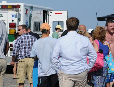 Bystanders gathered as Juan Carlos Salvana, 30, of Long Island City was loaded into an ambulance after coming close to drowning at Main Beach in East Hampton Village last Thursday. Bystanders gathered as Juan Carlos Salvana, 30, of Long Island City was loaded into an ambulance after coming close to drowning at Main Beach in East Hampton Village last Thursday.