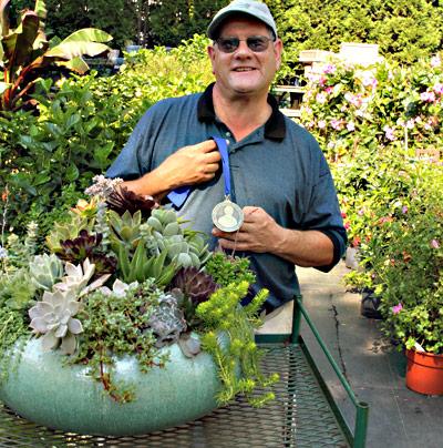 Don Horowitz, a co-owner of Wittendale’s Florist and Greenhouses, won a medal for his entry in the Kathy Pufahl Container Design Competition.