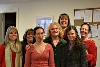 Emily Grunewald, center, with her fellow court clerks just days before her retirement last month, after 23 years on the job. From the left were Nicole Shipman, Michelle Field, Tamara Palmer, Ms. Gruenwald, Jennifer Anderson, Betsy Martin, and Jennifer Salsedo.