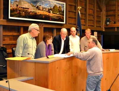 Cate Rogers, second from left, returned to serve on the East Hampton Zoning Board of Appeals after a four-year absence. With her Tuesday at Town Hall were Don Cirillo, Alex Walter, David Lys, and Bryan Gosman, as they discussed a pending application with the Planning Department’s Brian Frank. Cate Rogers, second from left, returned to serve on the East Hampton Zoning Board of Appeals after a four-year absence. With her Tuesday at Town Hall were Don Cirillo, Alex Walter, David Lys, and Bryan Gosman, as they discussed a pending application with the Planning Department’s Brian Frank.