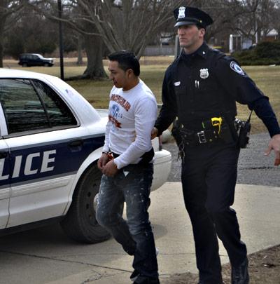 East Hampton Town police lead Juan Jose Zhingri-Deleg into East Hampton Town Justice Court for arraignment on Tuesday. East Hampton Town police lead Juan Jose Zhingri-Deleg into East Hampton Town Justice Court for arraignment on Tuesday.