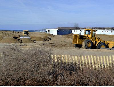 Bulldozers yesterday moved earth and sand at the former East Deck Motel in Montauk, fortifying the property’s seaward edge. Bulldozers yesterday moved earth and sand at the former East Deck Motel in Montauk, fortifying the property’s seaward edge.