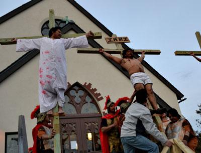 Ricardo Santos, Adrian Sanchez, and Marco Gutama were raised on crosses in the crucifixion scene from a Spanish-language production of the passion play at St. Therese of Lisieux Catholic Church in Montauk Friday. Ricardo Santos, Adrian Sanchez, and Marco Gutama were raised on crosses in the crucifixion scene from a Spanish-language production of the passion play at St. Therese of Lisieux Catholic Church in Montauk Friday.