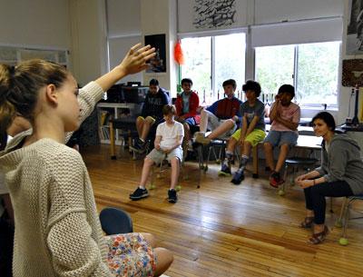 Joanna Howard, seated at right, a teaching artist with Project Hero, oversaw a group session with East Hampton Middle School students on Friday. Joanna Howard, seated at right, a teaching artist with Project Hero, oversaw a group session with East Hampton Middle School students on Friday.