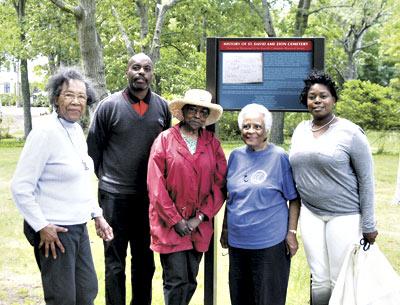 Celebrating good news for the St. David A.M.E. Zion Cemetery were, from left, Kathleen Tucker, the Eastville Community Historical Society’s historian; Gary Cole, whose great-grandmother was buried there; Gloria Primm Brown; Eunice Jackie Vaughan, the society’s president, and Georgette Grier-Key, the society’s director. Celebrating good news for the St. David A.M.E. Zion Cemetery were, from left, Kathleen Tucker, the Eastville Community Historical Society’s historian; Gary Cole, whose great-grandmother was buried there; Gloria Primm Brown; Eunice Jackie Vaughan, the society’s president, and Georgette Grier-Key, the society’s director.