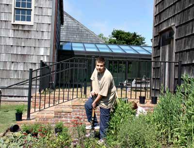 Matt Lester, a Life Scout working toward becoming an Eagle Scout, helped members of the Garden Club of East Hampton install a butterfly garden at East Hampton Town Hall Monday. Matt Lester, a Life Scout working toward becoming an Eagle Scout, helped members of the Garden Club of East Hampton install a butterfly garden at East Hampton Town Hall Monday.