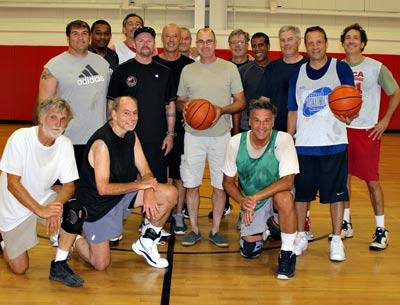 Richard Hand, center, stopped by the Pierson middle school gym on Sunday to thank fellow basketball players who had resuscitated him when he was in cardiac arrest just a week earlier.