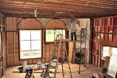 An electrician was busy last week installing wiring for a chandelier in the Studio. The upside-down transom is back from repair, still upside-down.