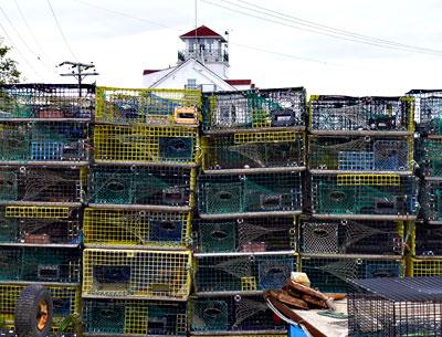 A wall of lobster pots spells the end of a season. A wall of lobster pots spells the end of a season.