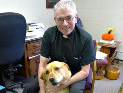 The Rev. Thomas Patrick Murray of St. Therese of Lisieux Catholic Church, with his dog, the Monsignor, compares Montauk to Mayberry. The Rev. Thomas Patrick Murray of St. Therese of Lisieux Catholic Church, with his dog, the Monsignor, compares Montauk to Mayberry.