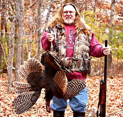 Harvey Bennett, Thanksgiving provider, with wild turkey in hand Harvey Bennett, Thanksgiving provider, with wild turkey in hand