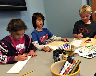 Wainscott’s third-grade class, from left Siena Link-Morse, Alex Hepburn, and Mason Barris, sketched designs they’ll paint on ceramic tiles that will be installed at the school. The school’s superintendent hopes it will become a new tradition. Wainscott’s third-grade class, from left Siena Link-Morse, Alex Hepburn, and Mason Barris, sketched designs they’ll paint on ceramic tiles that will be installed at the school. The school’s superintendent hopes it will become a new tradition.