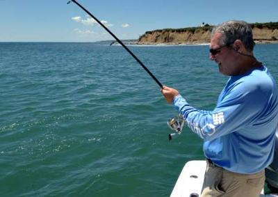 Light-weight rods have been bowing deeply to the big blues off Montauk Point, as Lou Rosado demonstrated aboard Capt. Ken Rafferty’s boat this week.