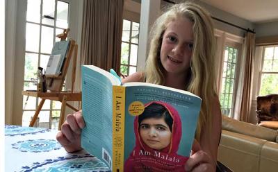 Annelise Mendelman, 14, is reading “I Am Malala” as part of a group effort launched in June by East Hampton High School.