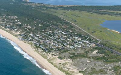A resident of Dolphin Drive, a street on a narrow portion of Napeague, has sued East Hampton Town to prevent cars from parking on his road, which he says will lead to degradation of dunes and place his neighborhood in danger of flooding. A resident of Dolphin Drive, a street on a narrow portion of Napeague, has sued East Hampton Town to prevent cars from parking on his road, which he says will lead to degradation of dunes and place his neighborhood in danger of flooding.