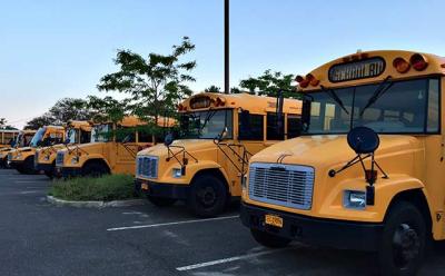 Most of the East Hampton School District’s 35 buses were lined up in the parking lot at East Hampton High School on Tuesday, where they are being kept while the bus depot on Route 114 is being repaved.