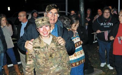 A crowd gathered at Hook Mill in East Hampton on Friday to welcome home Army Reserve First Lt. Elizabeth Mamay from a nine-month deployment. Among the well wishers was her grandfather John McNally. A crowd gathered at Hook Mill in East Hampton on Friday to welcome home Army Reserve First Lt. Elizabeth Mamay from a nine-month deployment. Among the well wishers was her grandfather John McNally.