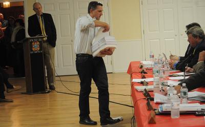Tom Steele, an active opponent of a proposal to establish a rental registry in East Hampton Town, distributed information to the town board at a hearing on the proposal last week. Tom Steele, an active opponent of a proposal to establish a rental registry in East Hampton Town, distributed information to the town board at a hearing on the proposal last week.