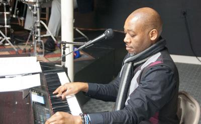 Melvin Robinson, an elder and pianist with the Genesis Choir, helped lead a tribute to the Rev. Dr. Martin Luther King Jr. at the Ross Lower School on Monday.