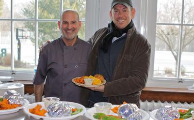 Daniel Pacella, the chef for the Bridgehampton School, left, and Sean Barrett, the founder of Dock to Dish, celebrated the road test of the school’s new fish burger lunch. Daniel Pacella, the chef for the Bridgehampton School, left, and Sean Barrett, the founder of Dock to Dish, celebrated the road test of the school’s new fish burger lunch.