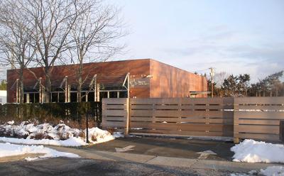 A fence Steven A. Cohen had built in front of his renovated building on Pantigo Road, East Hampton, was the subject of a planning board discussion on Feb. 9. A fence Steven A. Cohen had built in front of his renovated building on Pantigo Road, East Hampton, was the subject of a planning board discussion on Feb. 9.