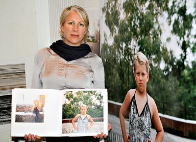 Lindsay Morris opened a copy of “You Are You” to “I Am,” an image of a camper posing for a portrait before a fashion show. The enlargement at right will be included in a Parrish Art Museum exhibition.