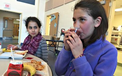 Jhoselin Narvaez Gutierrez, left, and Joana Gutierrez, fifth graders, chose smoothies made from strawberries, spinach, bananas, and apple juice during a recent lunch period at the John M. Marshall Elementary School. Jhoselin Narvaez Gutierrez, left, and Joana Gutierrez, fifth graders, chose smoothies made from strawberries, spinach, bananas, and apple juice during a recent lunch period at the John M. Marshall Elementary School.