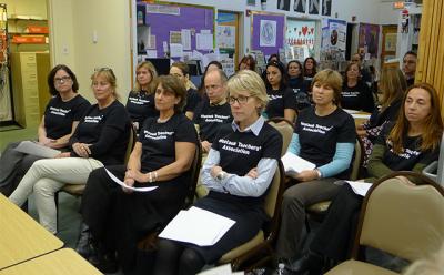 Teachers from the Montauk School wore black T-shirts to a school board meeting Tuesday to call attention to the fact that they’ve been working without a contract since July. Teachers from the Montauk School wore black T-shirts to a school board meeting Tuesday to call attention to the fact that they’ve been working without a contract since July.