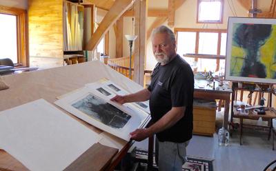 Dan Welden examined a portfolio of Solarplate prints in his mezzanine studio in Noyac. Dan Welden examined a portfolio of Solarplate prints in his mezzanine studio in Noyac.
