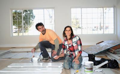 Jolie Parcher was at work on the former G.H. Bass & Co. shoe outlet space at Amagansett Square with help from Jaime Escalante in preparation for her yoga center’s move across the square this spring.