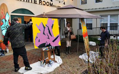 The artists known as CES, at left, and YES2 painted on canvas and surfboards at an opening at the White Room Gallery in Bridgehampton on Saturday. Below, a painting by CES on view in the show. The artists known as CES, at left, and YES2 painted on canvas and surfboards at an opening at the White Room Gallery in Bridgehampton on Saturday. Below, a painting by CES on view in the show.