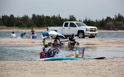 A resident of Springs told the East Hampton Town Trustees that the small beach just inside Three Mile Harbor is dangerously crowded with vehicles on some summer days.