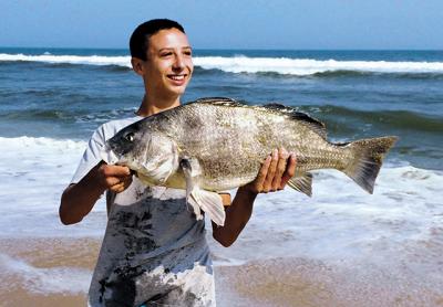 Robbie Downing, 15, caught a rare black drum at Hither Hills State Park.