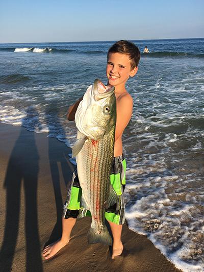 Eleven-year-old Ellis Whiteson from New York City caught a 20-pound striped bass on a bunker chunk while fishing from the beach at the Sea Crest Resort on the Napeague stretch.